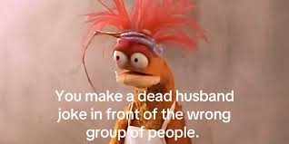 A startled puppet realizing a dead-husband joke was made in front of the wrong people